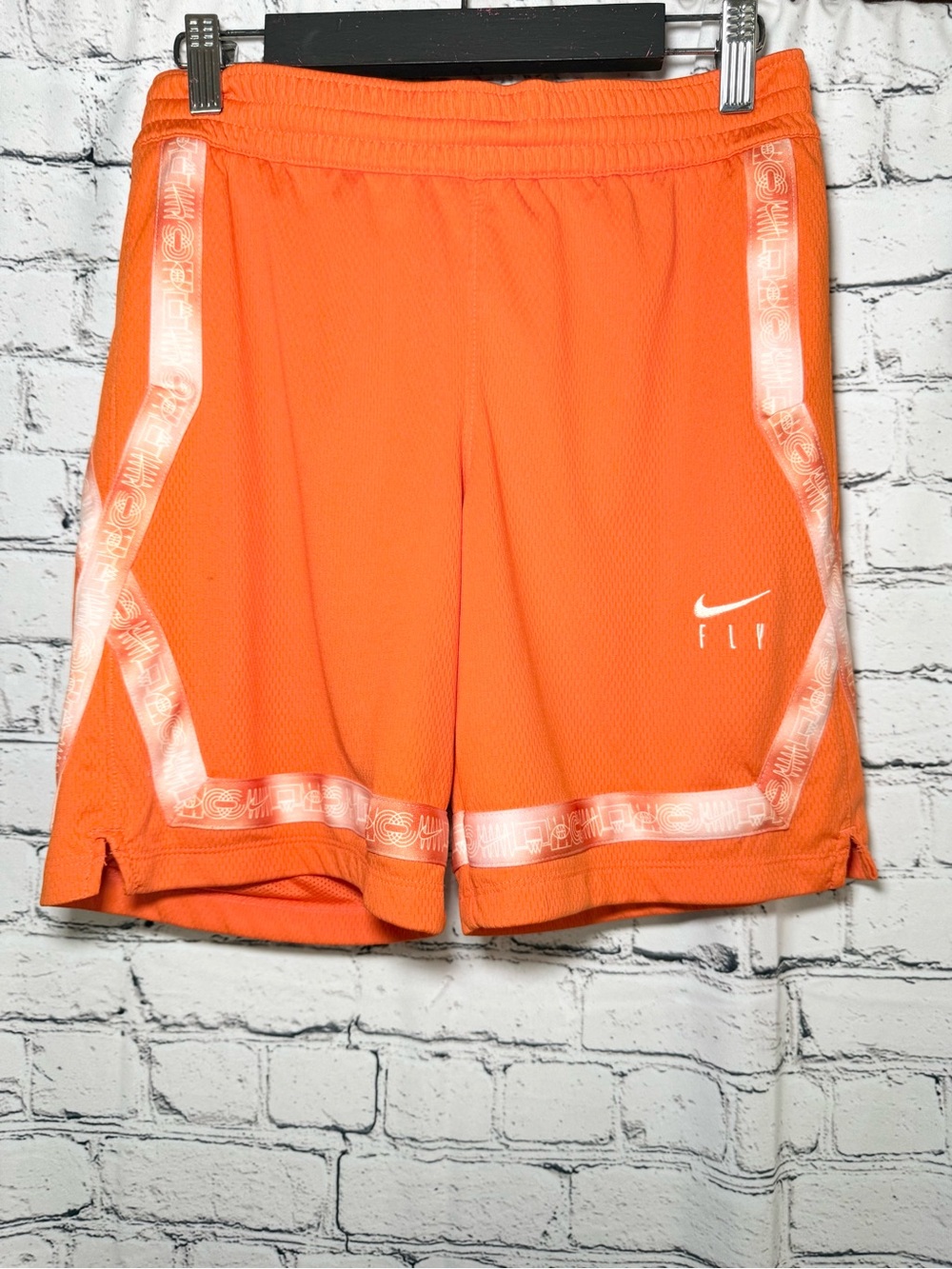 Nike. Orange shorts. Size L